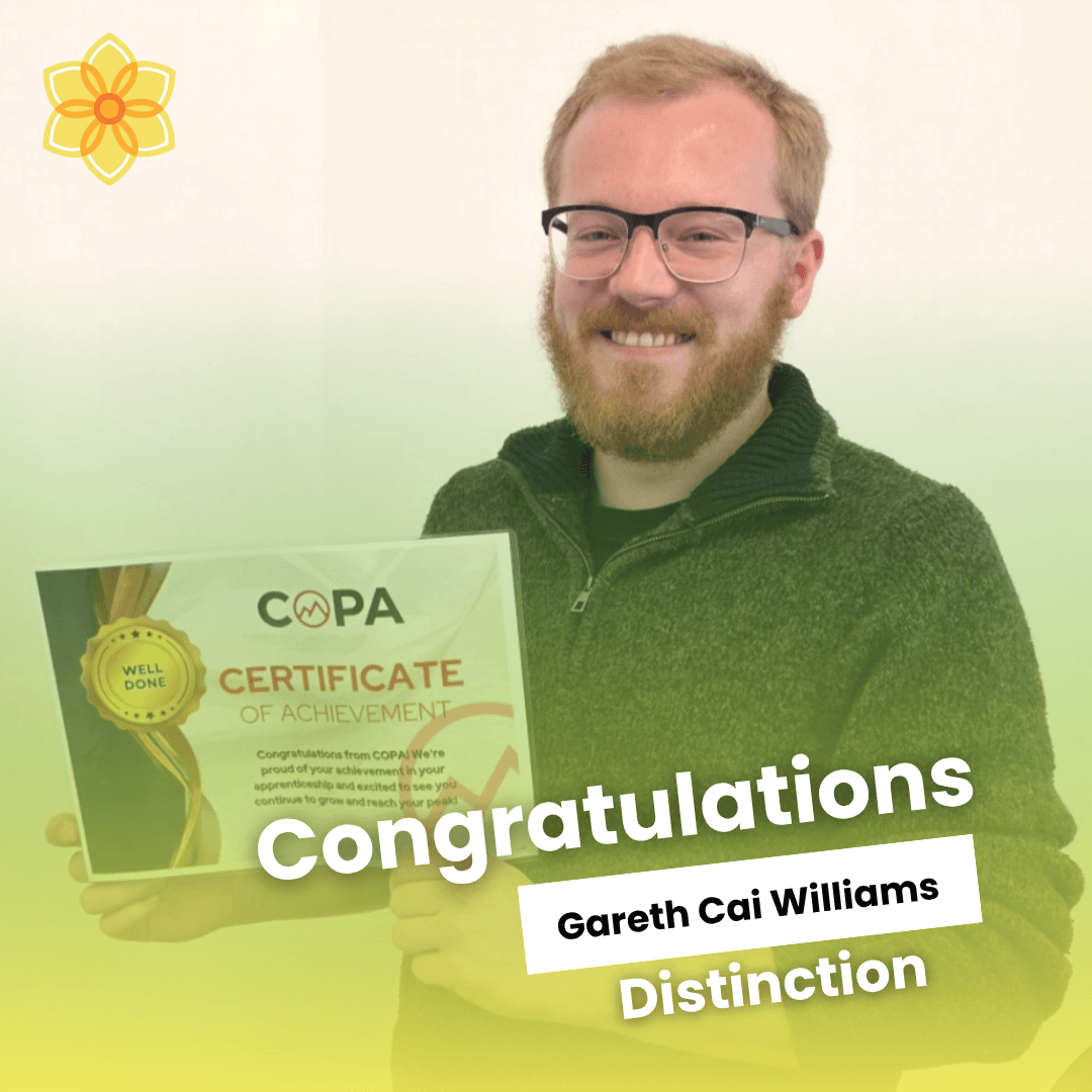 Cai Williams celebrating his Level 3 Health and Social Care qualification
