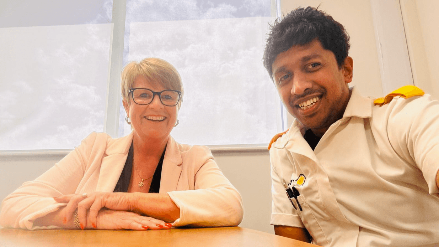 Yash Bandara smiling alongside a TLC colleague after completing the Level 2 Health and Social Care qualification