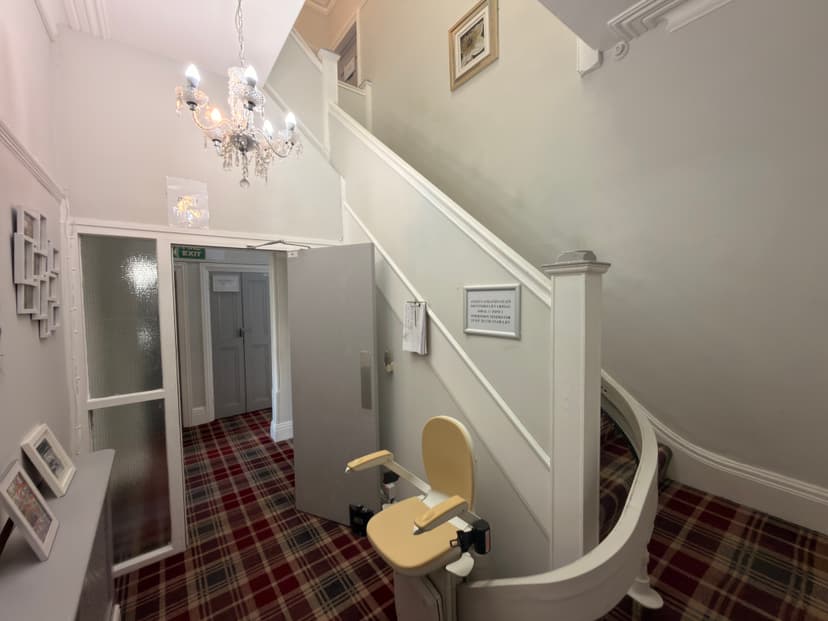 Bright entrance hallway and staircase at Chaseley House